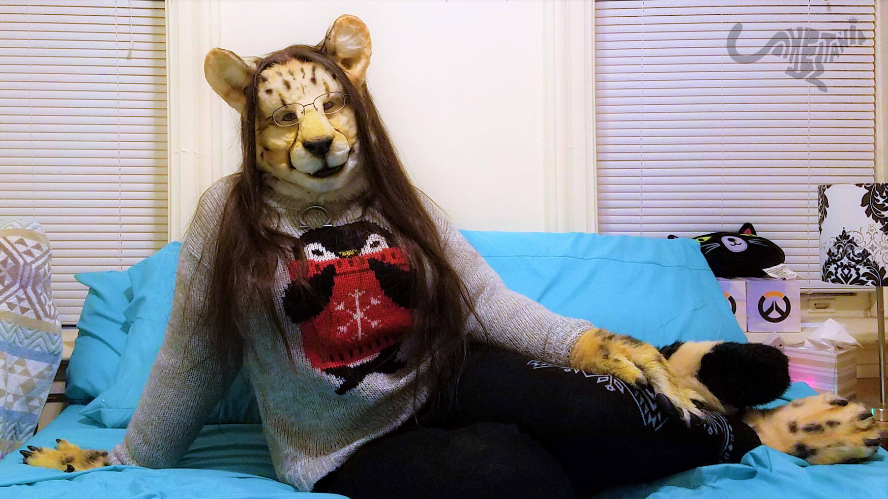 Shetani reclining on a bed