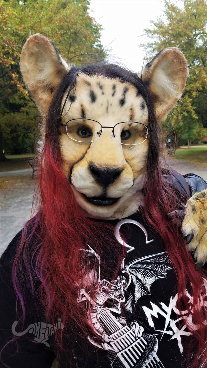 Close-up of Shetani&#39;s face, the tips of her hair dyed red
