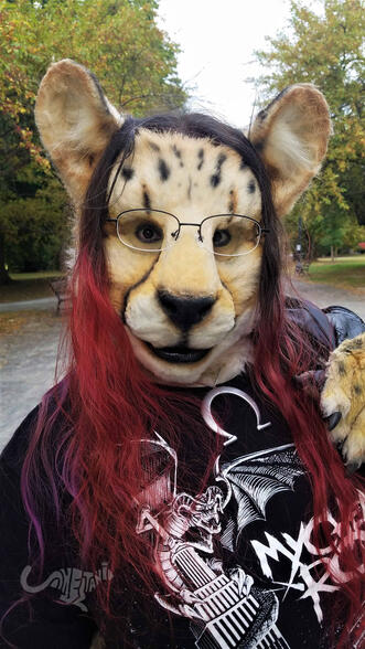 Close-up of Shetani's face, the tips of her hair dyed red Close-up of Shetani's face, the tips of her hair dyed red