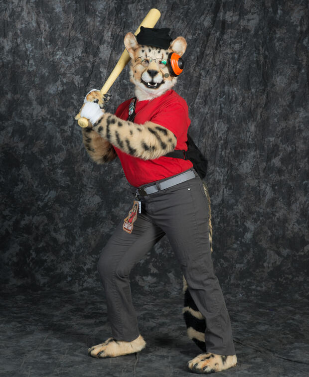 Photobooth picture of Shetani in fursuit cosplaying as the Red Scout from Team Fortress 2