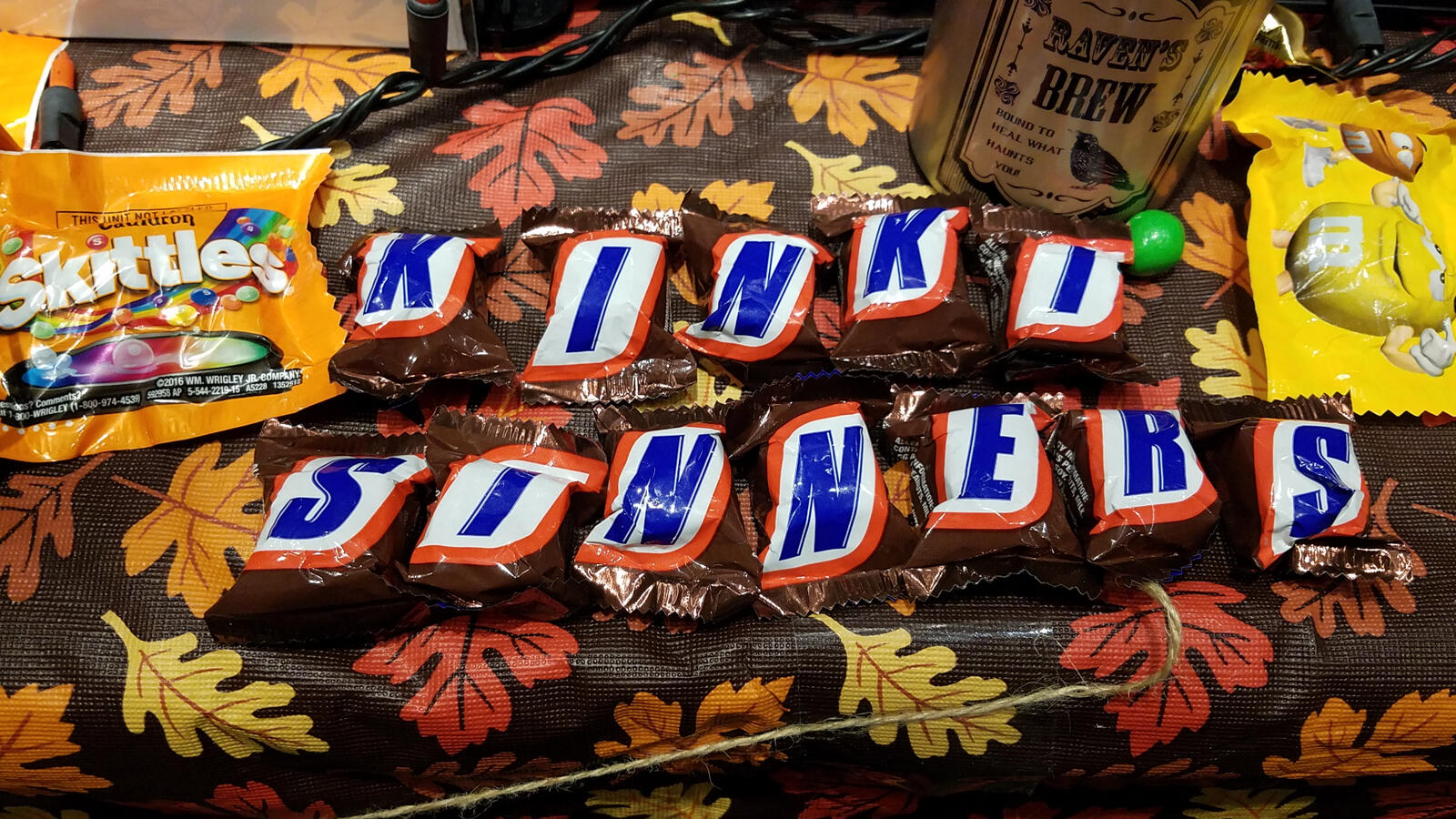 Mini-Snickers spelling out &quot;kinky sinners&quot;