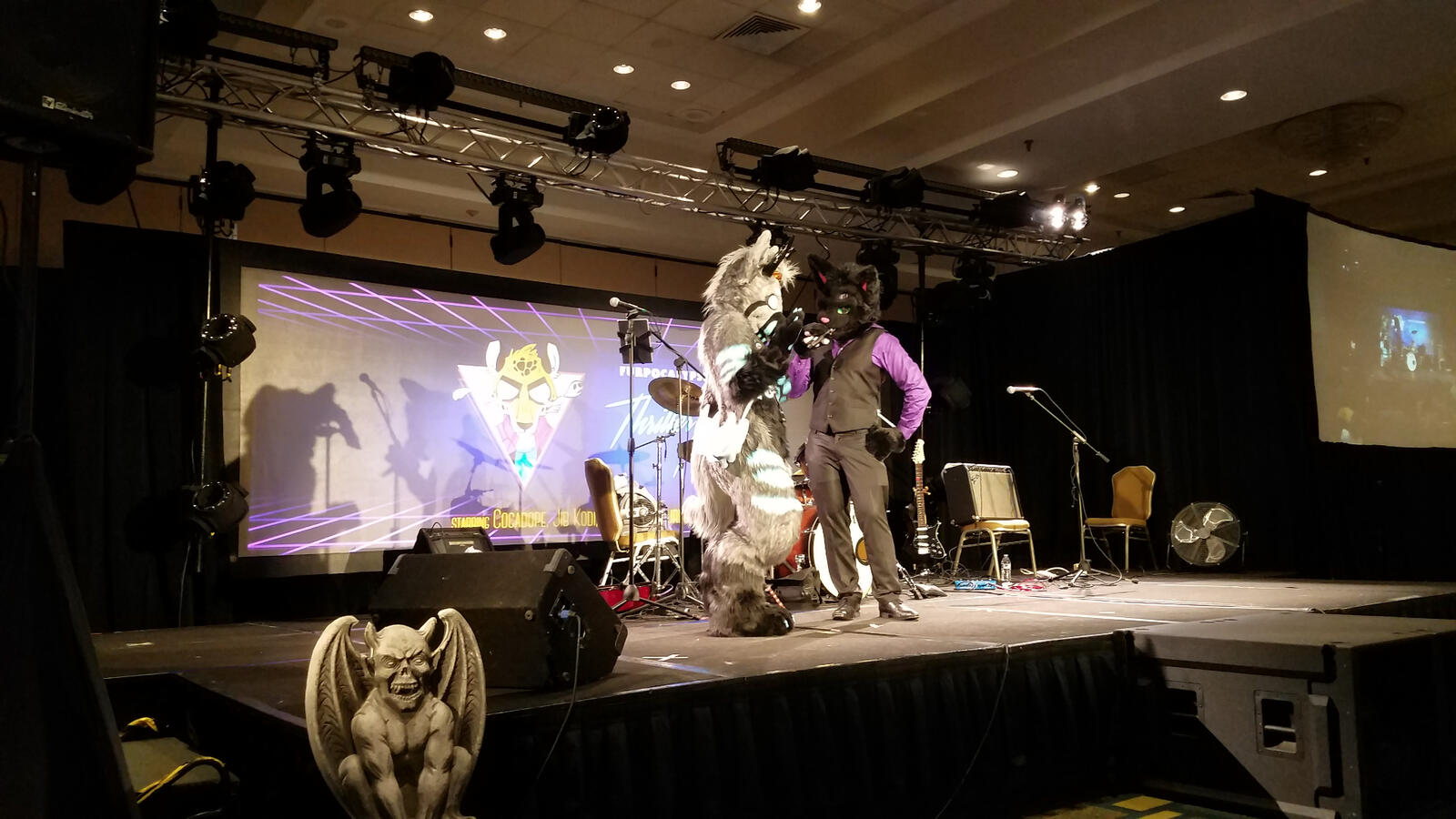 Nick Nocturne on stage with another fursuiter