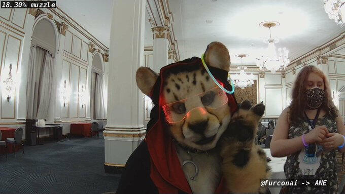 Furcon AI bot photo of Shetani in said getup, with addition of a glow bracelet over one ear. The guess is &quot;18.30% muzzle&quot;