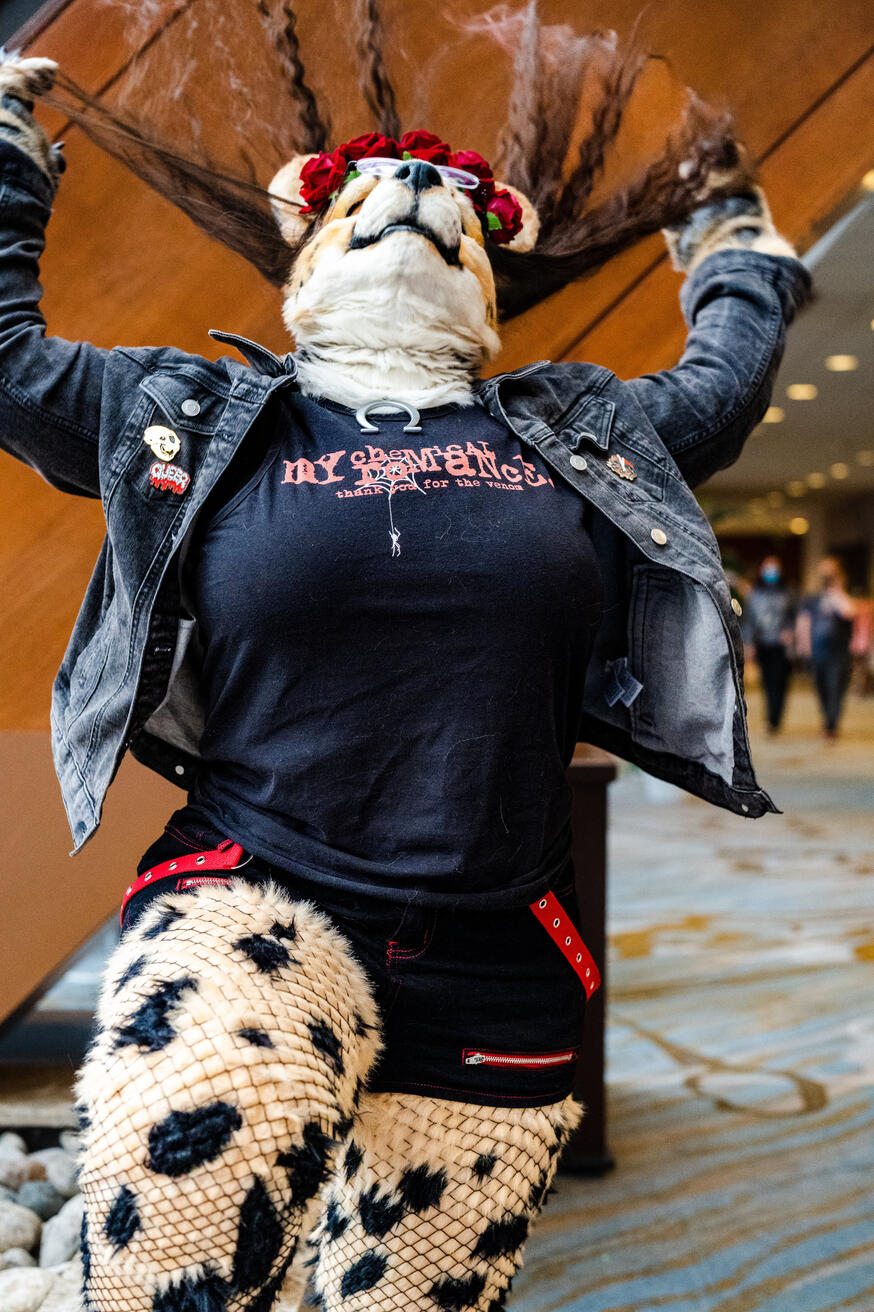 Action shot of Shetani flipping her long brown hair back like in a shampoo commercial